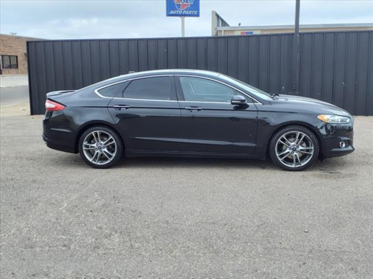 2013 Tuxedo Black Metallic Ford Fusion Titanium (3FA6P0K99DR) with an 2.0L EcoBoost 2.0L Turbo I4 240hp 270ft. lbs. Direct Injection engine, 6-Speed Shiftable Automatic transmission, located at 1401 N. Hobart, Pampa, TX, 79065, (806) 665-9872, 35.549953, -100.975098 - Photo#2