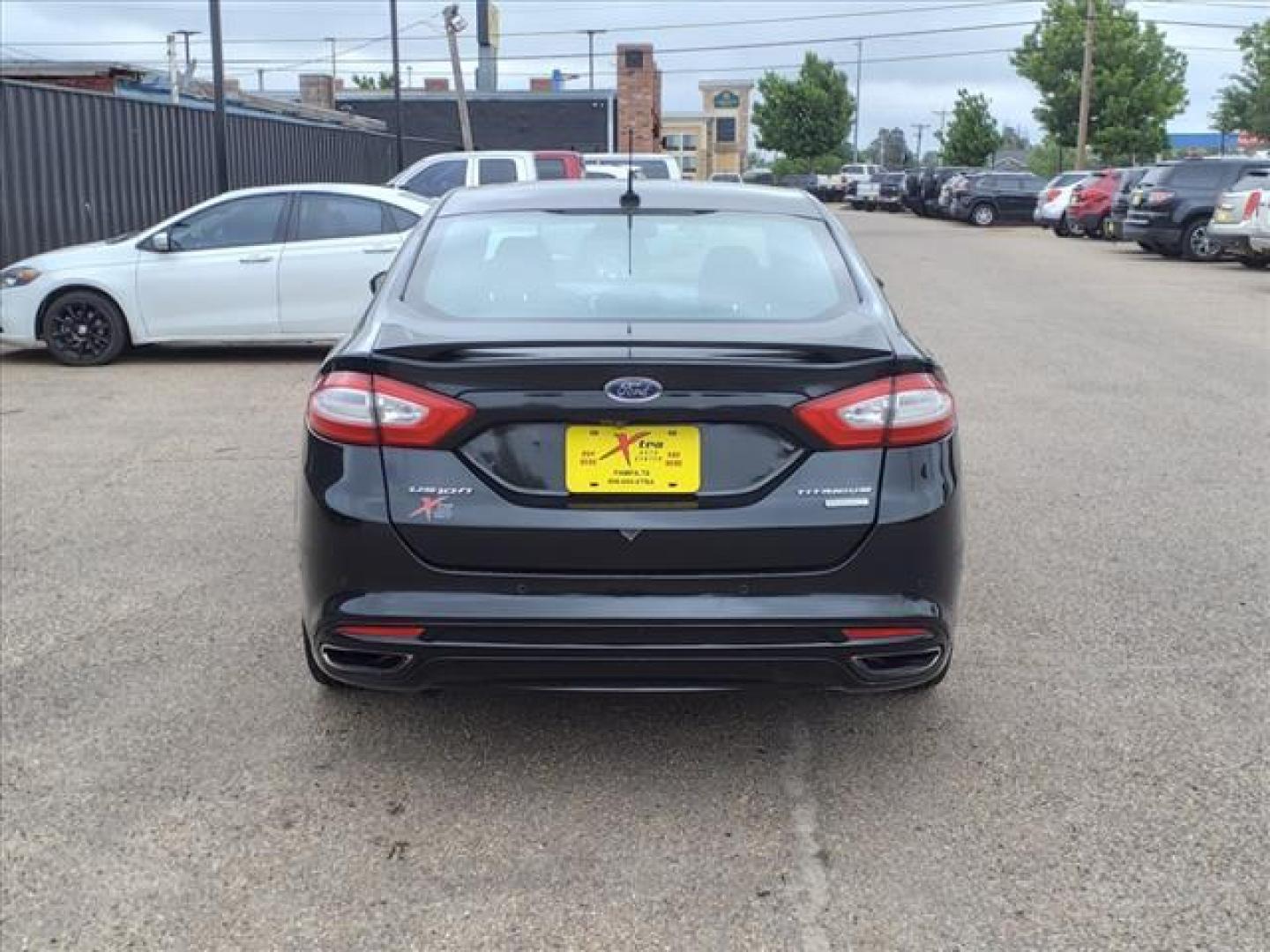 2013 Tuxedo Black Metallic Ford Fusion Titanium (3FA6P0K99DR) with an 2.0L EcoBoost 2.0L Turbo I4 240hp 270ft. lbs. Direct Injection engine, 6-Speed Shiftable Automatic transmission, located at 1401 N. Hobart, Pampa, TX, 79065, (806) 665-9872, 35.549953, -100.975098 - Photo#3