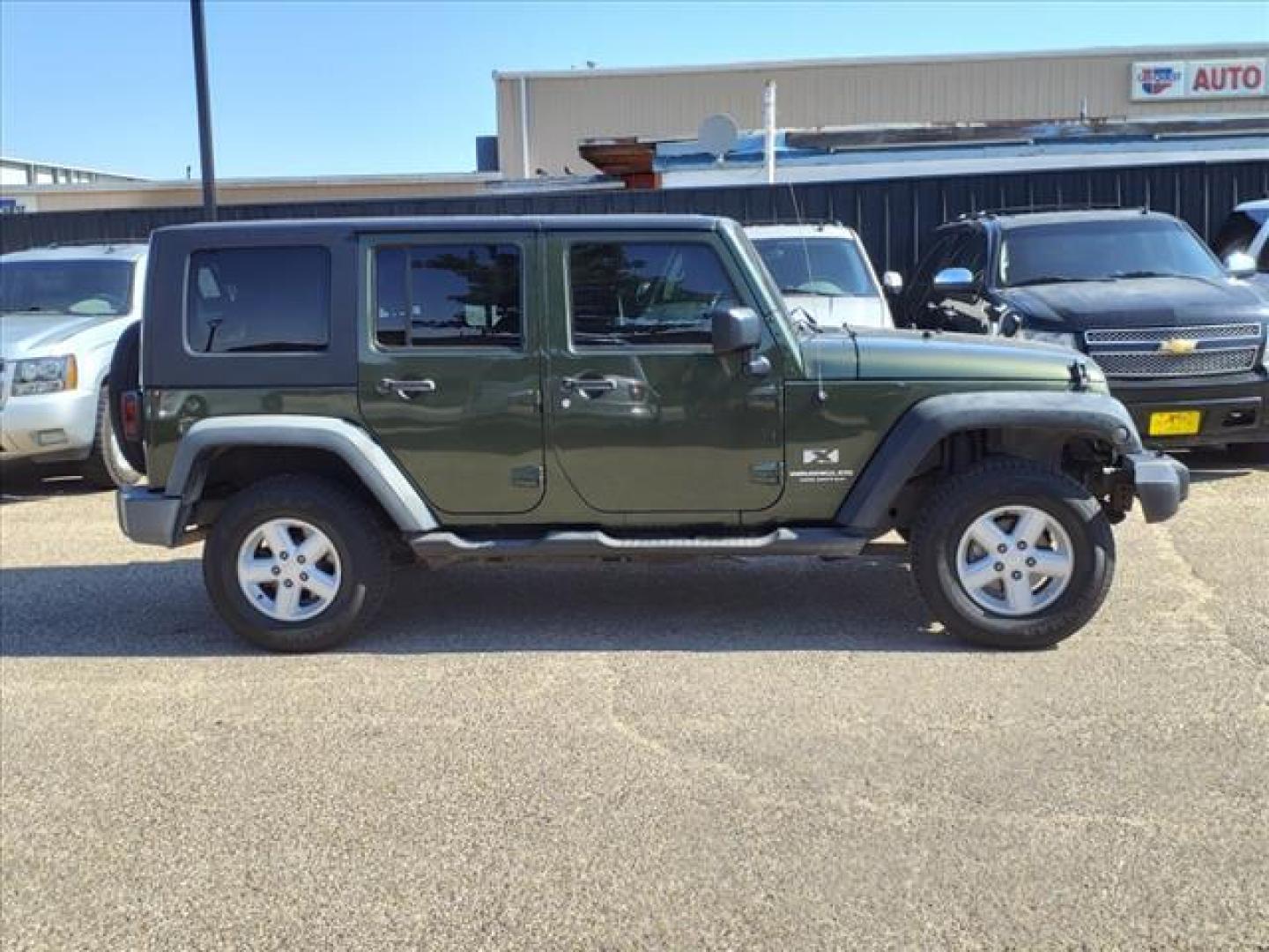 2007 Rescue Green Metallic Clearcoat Jeep Wrangler Unlimited X (1J4GA39137L) with an 3.8L 3.8L V6 205hp 240ft. lbs. Sequential Multiport Fuel Injection engine, 4-Speed Automatic transmission, located at 1401 N. Hobart, Pampa, TX, 79065, (806) 665-9872, 35.549953, -100.975098 - Photo#2