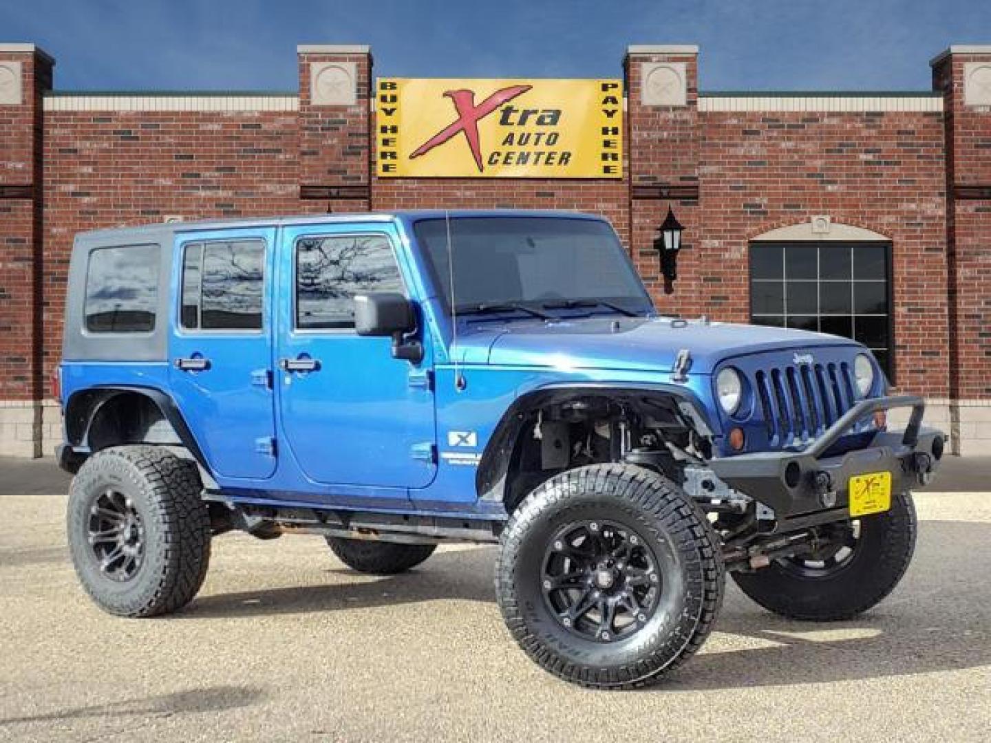 2009 Deep Water Blue Pearl Coat Jeep Wrangler Unlimited X (1J4GA39169L) with an 3.8L 3.8L V6 205hp 240ft. lbs. Sequential Multiport Fuel Injection engine, 6-Speed Manual transmission, located at 1401 N. Hobart, Pampa, TX, 79065, (806) 665-9872, 35.549953, -100.975098 - Photo#0