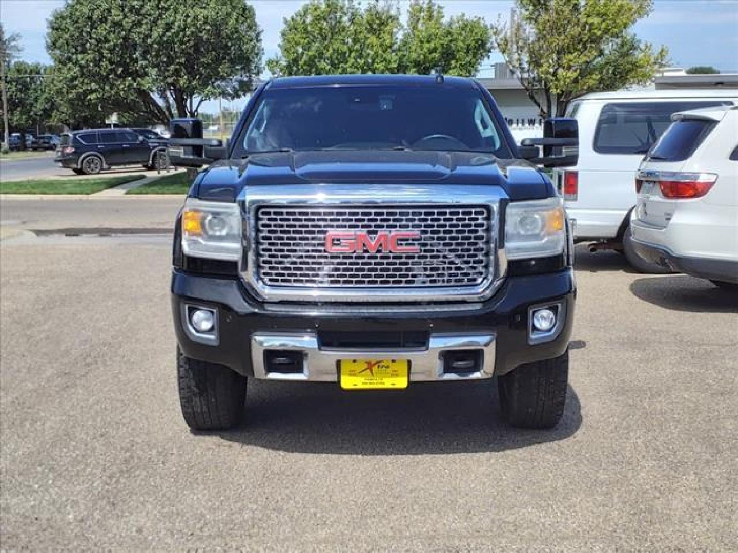 2015 Onyx Black GMC Sierra 2500HD Denali (1GT120EG2FF) with an 6.0L Vortec 6.0L Flex Fuel V8 360hp 380ft. lbs. Sequential Electronic Fuel Injection engine, 6-Speed Shiftable Automatic transmission, located at 1401 N. Hobart, Pampa, TX, 79065, (806) 665-9872, 35.549953, -100.975098 - Photo#1