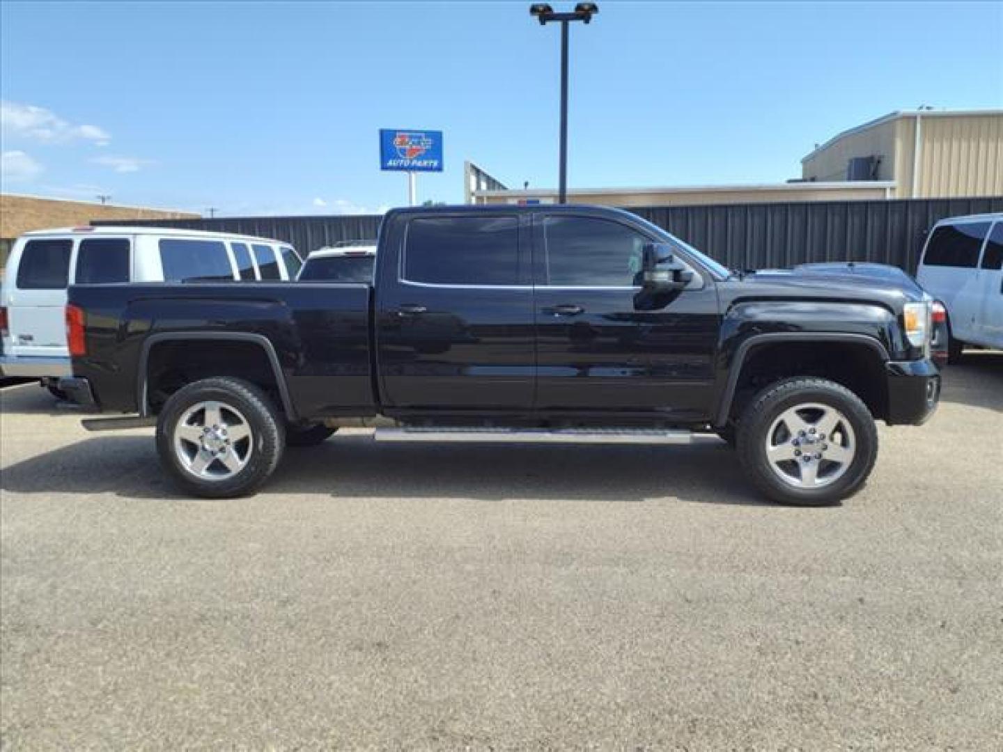 2015 Onyx Black GMC Sierra 2500HD Denali (1GT120EG2FF) with an 6.0L Vortec 6.0L Flex Fuel V8 360hp 380ft. lbs. Sequential Electronic Fuel Injection engine, 6-Speed Shiftable Automatic transmission, located at 1401 N. Hobart, Pampa, TX, 79065, (806) 665-9872, 35.549953, -100.975098 - Photo#2