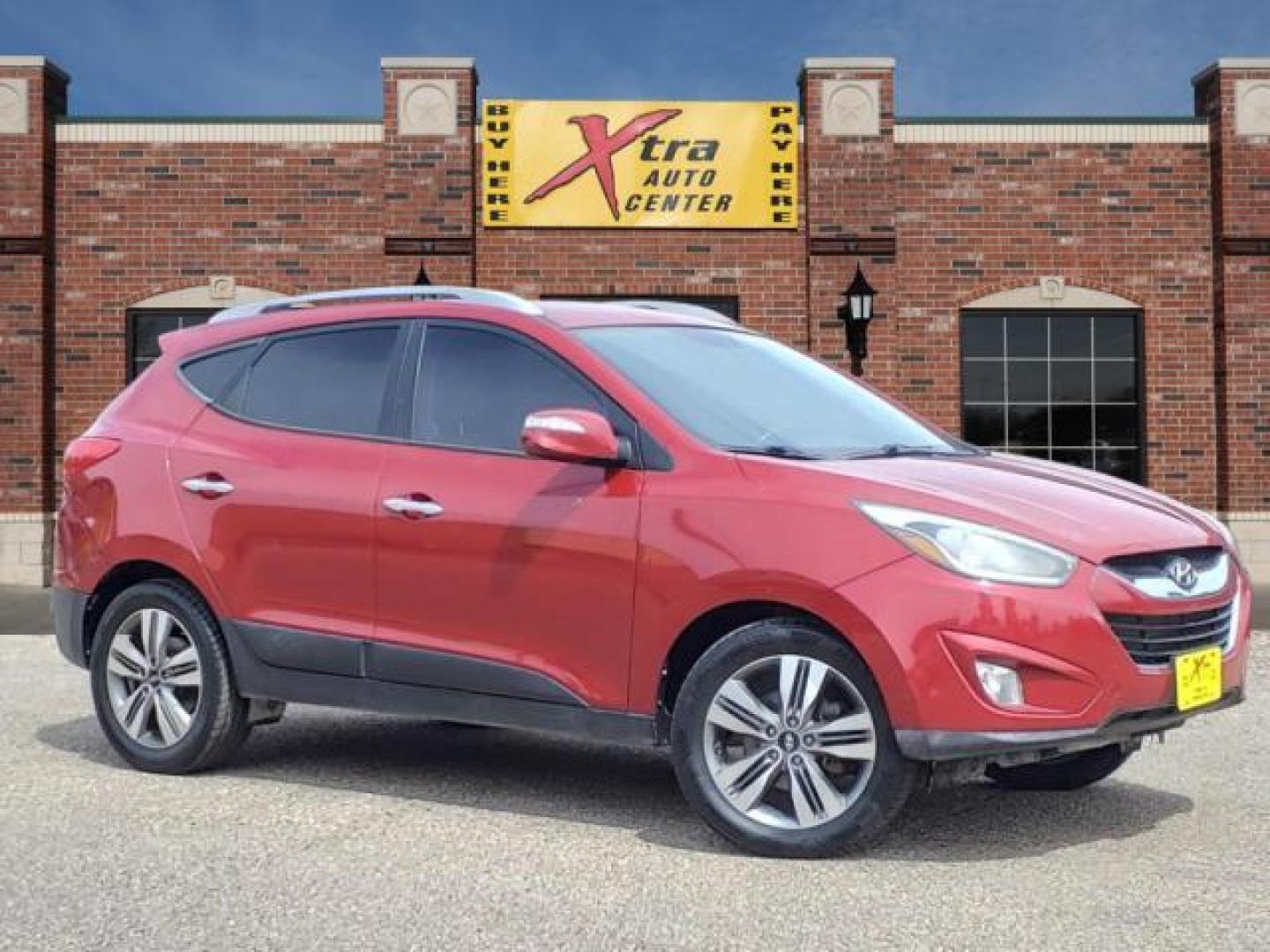 2014 Garnet Red Hyundai TUCSON Limited (KM8JUCAG2EU) with an 2.4L 2.4L I4 182hp 177ft. lbs. Direct Injection engine, 6-Speed Shiftable Automatic transmission, located at 1401 N. Hobart, Pampa, TX, 79065, (806) 665-9872, 35.549953, -100.975098 - Photo#0