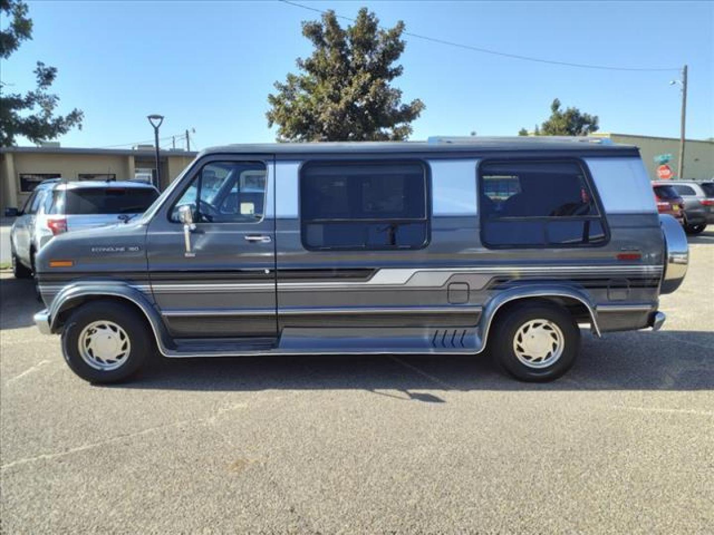 1990 Gray Ford E-150 Bivouac (1FDEE14H6LH) with an 8 Cylinder Fuel Injected engine, Automatic transmission, located at 1401 N. Hobart, Pampa, TX, 79065, (806) 665-9872, 35.549953, -100.975098 - Photo#4