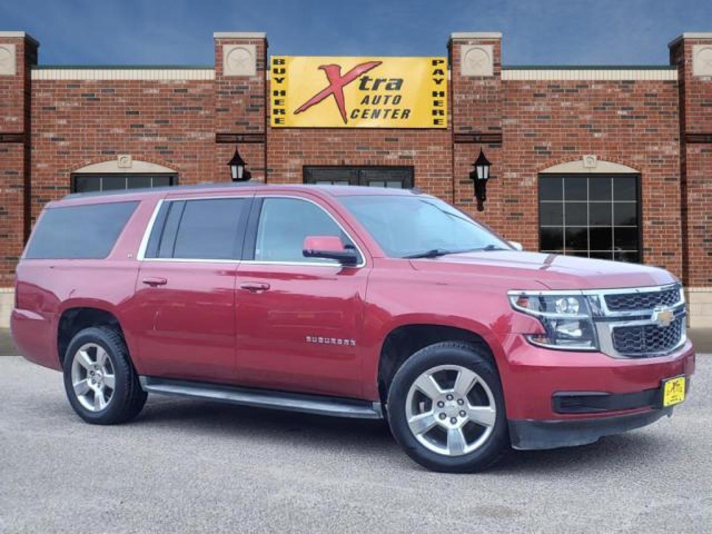 2015 Crystal Red Tintcoat Chevrolet Suburban LT (1GNSKJKC5FR) with an 5.3L EcoTec3 5.3L Flex Fuel V8 355hp 383ft. lbs. Direct Injection engine, 6-Speed Shiftable Automatic w/Overdrive transmission, located at 1401 N. Hobart, Pampa, TX, 79065, (806) 665-9872, 35.549953, -100.975098 - Photo#0