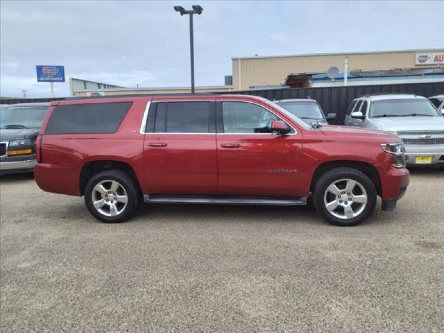 2015 Crystal Red Tintcoat Chevrolet Suburban LT (1GNSKJKC5FR) with an 5.3L EcoTec3 5.3L Flex Fuel V8 355hp 383ft. lbs. Direct Injection engine, 6-Speed Shiftable Automatic w/Overdrive transmission, located at 1401 N. Hobart, Pampa, TX, 79065, (806) 665-9872, 35.549953, -100.975098 - Photo#2