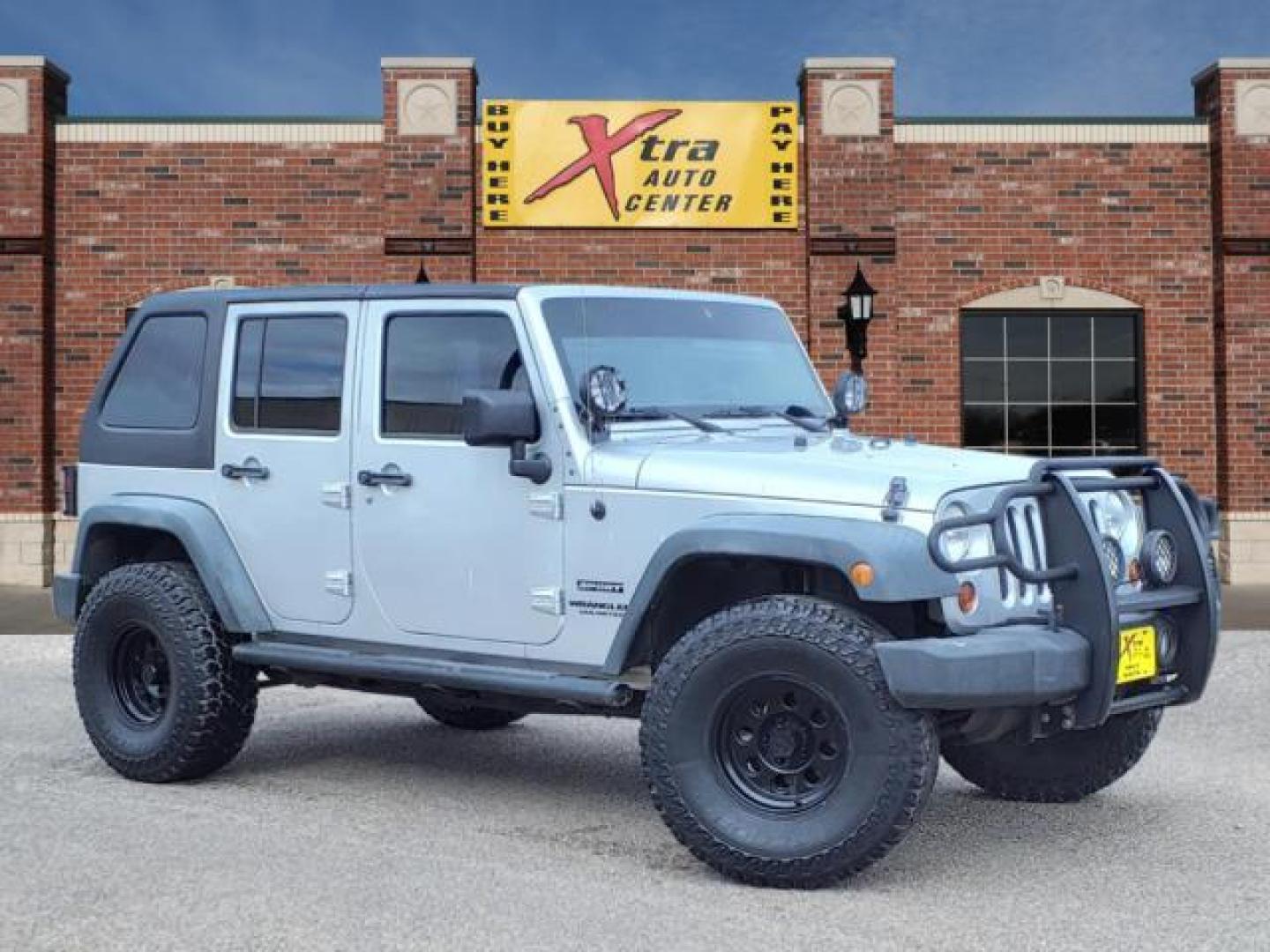 2012 Bright Silver Metallic Clear Coat Ps2 Jeep Wrangler Unlimited Sport (1C4BJWDG7CL) with an 3.6L 3.6L V6 285hp 260ft. lbs. Sequential Multiport Fuel Injection engine, 6-Speed Manual transmission, located at 1401 N. Hobart, Pampa, TX, 79065, (806) 665-9872, 35.549953, -100.975098 - Photo#0