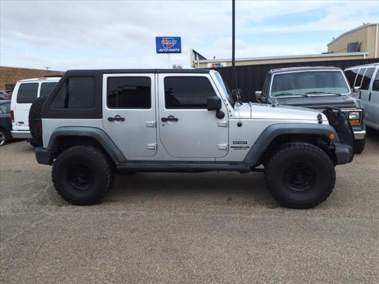 2012 Bright Silver Metallic Clear Coat Ps2 Jeep Wrangler Unlimited Sport (1C4BJWDG7CL) with an 3.6L 3.6L V6 285hp 260ft. lbs. Sequential Multiport Fuel Injection engine, 6-Speed Manual transmission, located at 1401 N. Hobart, Pampa, TX, 79065, (806) 665-9872, 35.549953, -100.975098 - Photo#2