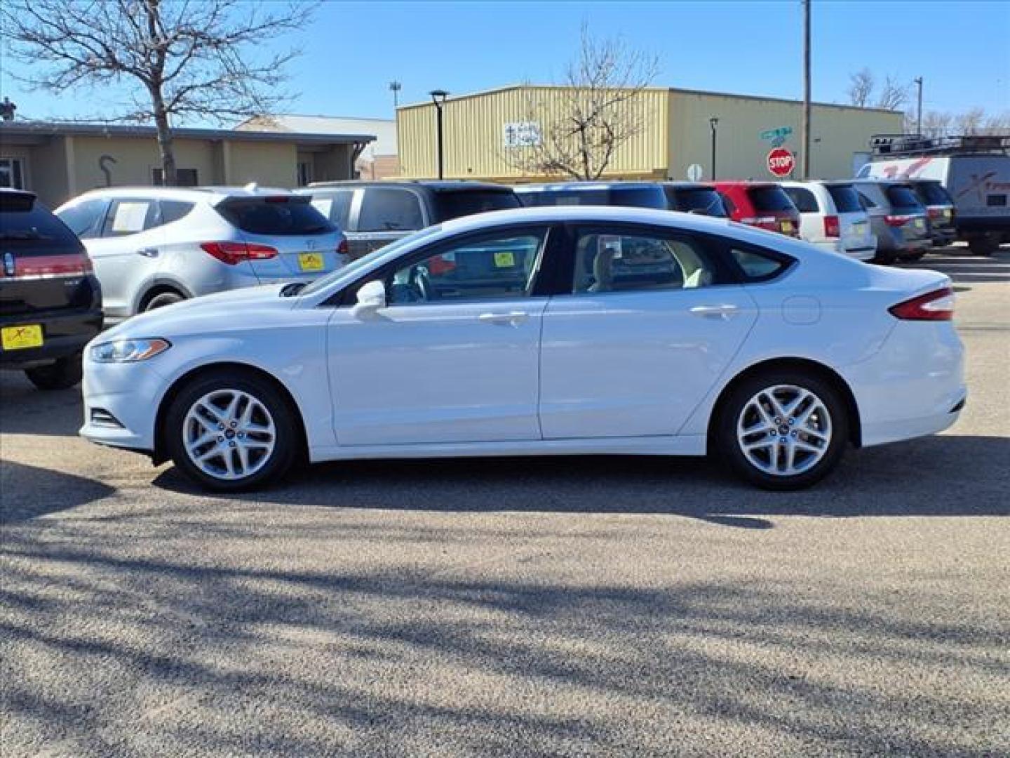 2016 Oxford White Yz Ford Fusion SE (3FA6P0H73GR) with an 2.5L 2.5L I4 175hp 175ft. lbs. Sequential Multiport Fuel Injection engine, 6-Speed Shiftable Automatic transmission, located at 1401 N. Hobart, Pampa, TX, 79065, (806) 665-9872, 35.549953, -100.975098 - Photo#4