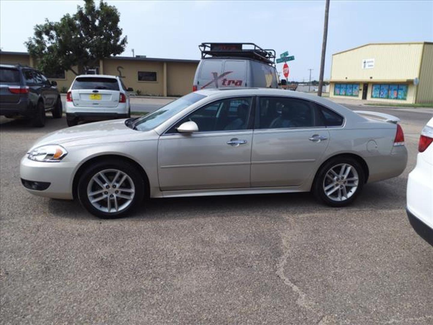 2012 Gold Mist Metallic Chevrolet Impala LTZ (2G1WC5E35C1) with an 3.6L 3.6L Flex Fuel V6 300hp 262ft. lbs. Direct Injection engine, 6-Speed Shiftable Automatic w/Overdrive transmission, located at 1401 N. Hobart, Pampa, TX, 79065, (806) 665-9872, 35.549953, -100.975098 - Photo#4