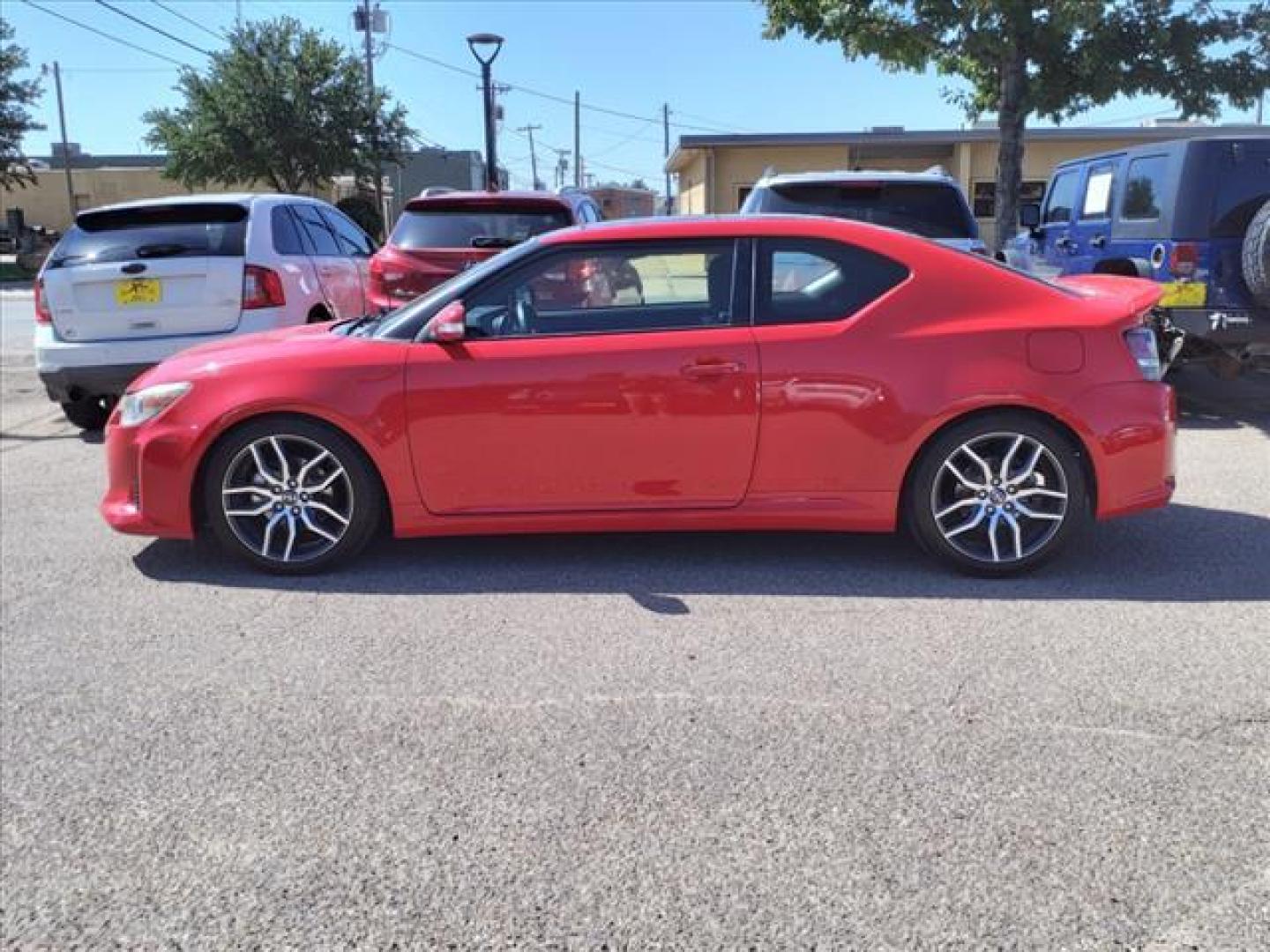 2015 Absolutely Red Scion tC Base (JTKJF5C71F3) with an 2.5L 2.5L I4 179hp 172ft. lbs. Sequential Multiport Fuel Injection engine, 6-Speed Manual transmission, located at 1401 N. Hobart, Pampa, TX, 79065, (806) 665-9872, 35.549953, -100.975098 - Photo#4